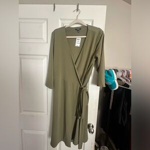 New with tags! Never worn! Ties on the side wrap dress